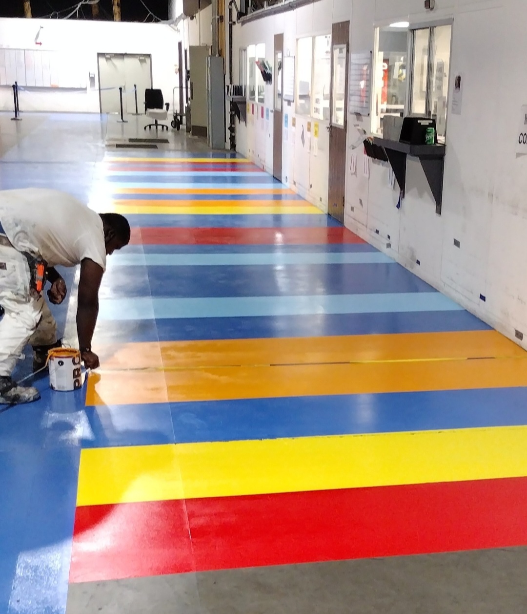 Aesthetic Multi-color Epoxy Floor Staging Area in a Warehouse.